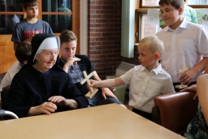 Youth Convention participants visit and serve the Residents of St. Joseph's Adult Care Home